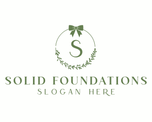 Ribbon Leaf Wreath  Logo