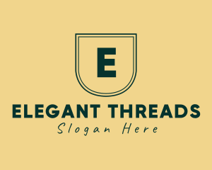 Elegant Shield Fashion Apparel logo design