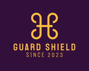 Defend - Golden Shield Letter H logo design