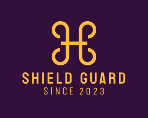 Defend - Golden Shield Letter H logo design