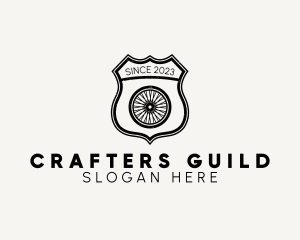 Guild - Rustic Bicycle Wheel Shield logo design
