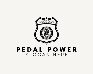 Pedal - Rustic Bicycle Wheel Shield logo design
