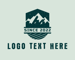 Grunge - Outdoor Mountaineering Shield logo design