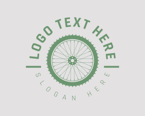 Bike Shop - Cyclist Wheel Emblem logo design