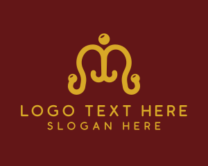 Letter M - Ornate Coat Hanger logo design
