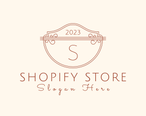 Classic Ornate Shield Boutique logo design