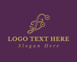 Golden Floral Letter E Logo