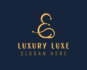 Gold Luxury Ampersand logo design