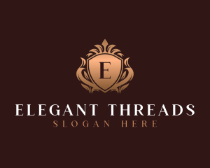 Luxury Crown Ornamental Shield logo design