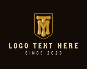 Letter Tm - Golden Shield Gamer Letter TM logo design