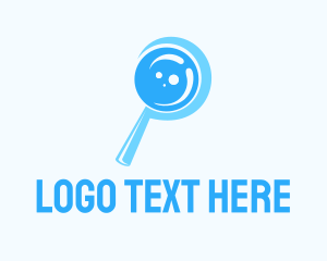 Blue Magnifying Glass Logo