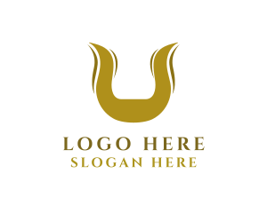 Cow - Gold Horns Letter U logo design