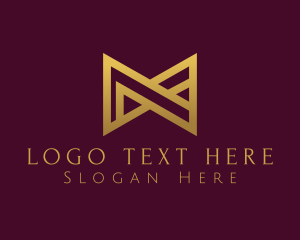 Luxurious Modern Bow Tie Letter M logo design